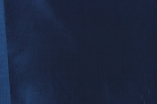 Taffeta fabric in iridescent in dark blue. 