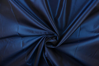 Taffeta fabric in iridescent in dark blue. 