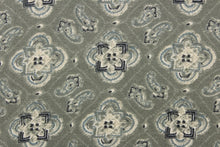 Load image into Gallery viewer, This chiffon fabric features a medallion design in blue, gray, and navy against a grayish green. This fabric is sheer.
