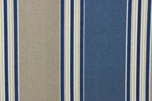  This outdoor fabric features a vertical stripe design in gray, beige, white and blue.