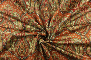 This fabric features a damask paisley design in orange, red, brown, white, blue green, and gold. 