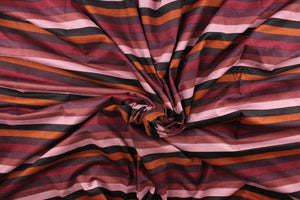 This suede lycra fabric features a horizontal stripe design in orange, black, purple, plum, mauve, and pale purple. 