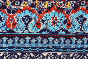 This 1 way lycra jersey blend fabric features an abstract design in blue, red, white, yellow and aqua. 