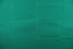 This fabric in a solid true green color is great for umbrellas, outdoor upholstery and more. 