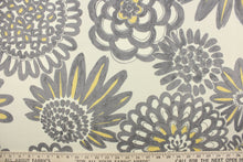 Load image into Gallery viewer, This fabric features a large print floral design in gray and yellow on a beige background and is perfect for any project where the fabric will be exposed to the weather.  
