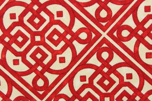 This screen printed fabric features a charming lattice print design in red against an off white cotton club print cloth. 