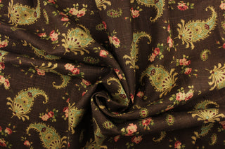This fabric features a paisley and floral design on a chocolate brown background. Colors include brown, red, pink, green and gold.