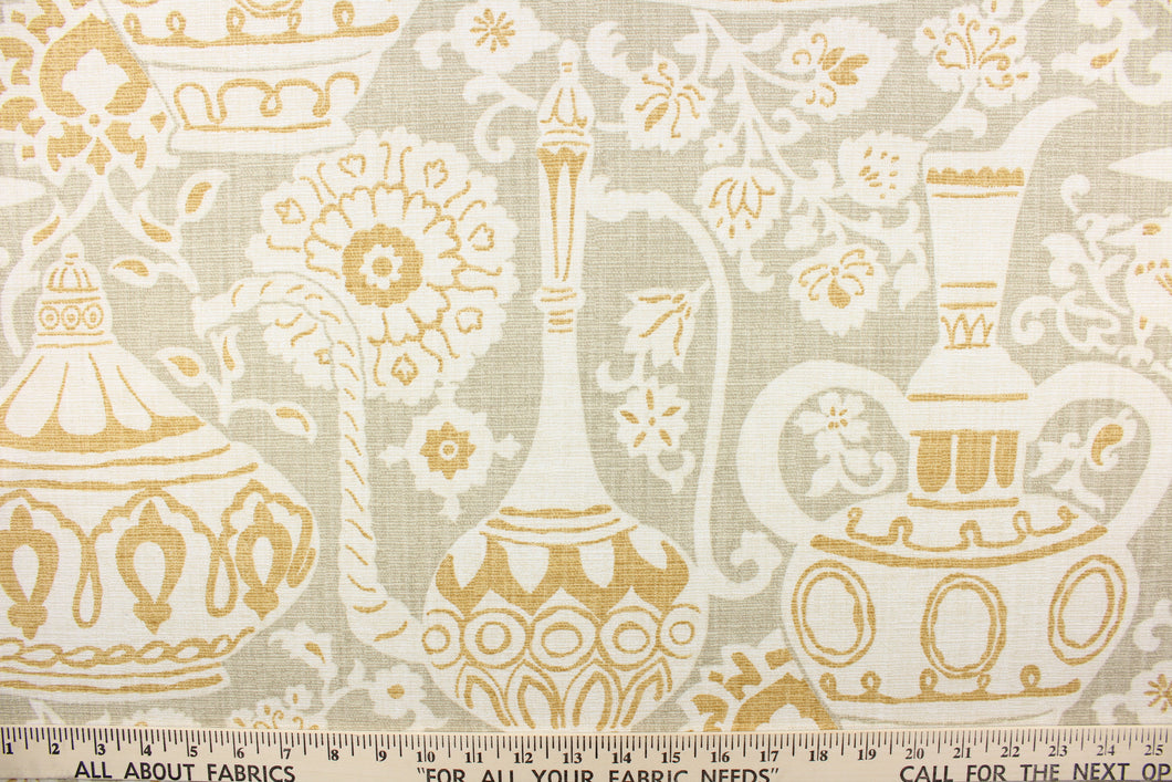 This screen printed on cotton slub fabric features decorative jars with accents of birds and foliage.  Colors include cream, gold and brown.