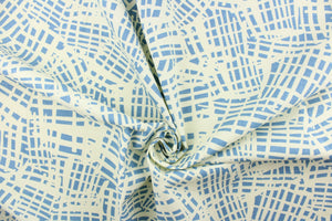 This screen printed fabric features a unique design in sky blue and off white. 
