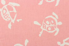 Load image into Gallery viewer, This fun fabric features cream colored turtles on a pink background.
