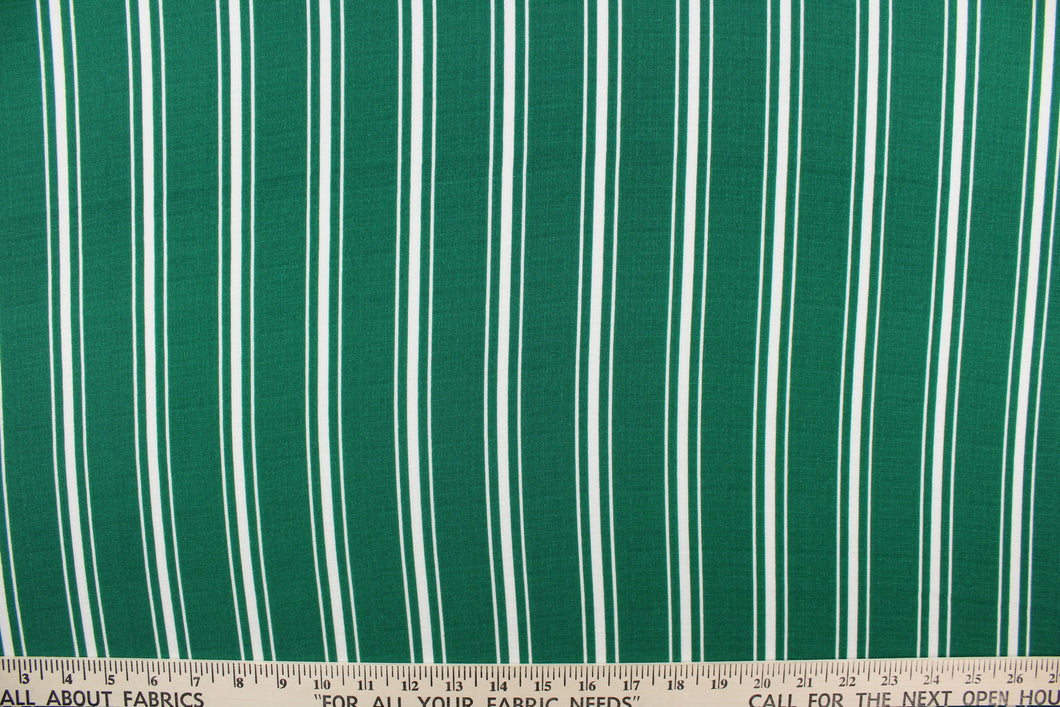 This georgette fabric features a stripe design in white and emerald green.