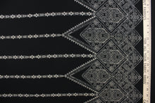 Load image into Gallery viewer, This georgette fabric features an Aztec design in pale beige against black. 
