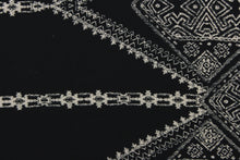 Load image into Gallery viewer, This georgette fabric features an Aztec design in pale beige against black. 
