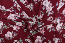Load image into Gallery viewer, This georgette fabric features a floral design in pink, blue, and green against a burgundy background. 
