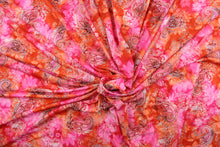 Load image into Gallery viewer, This 1 way lycra fabric features a paisley design in orange, pink, red, and white.
