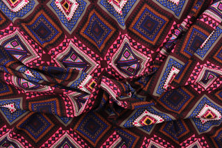  This 2 way lycra blend fabric features a Aztec design in hot pink, black, taupe, royal blue, gray, golden tan, white and burgundy. 