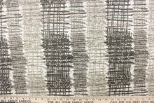 Load image into Gallery viewer, This fabric features a unique design in black, white, gray and taupe. 
