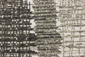 This fabric features a unique design in black, white, gray and taupe. 