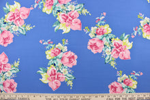Load image into Gallery viewer, This georgette fabric features a floral design in pink, yellow, white, green, and blue against a cornflower blue.
