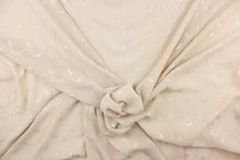 Load image into Gallery viewer, This chiffon fabric features a floral eyelet design in cream against a pale khaki.
