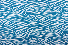 Load image into Gallery viewer,  This jersey blend fabric features a zebra stripe design in teal and white.
