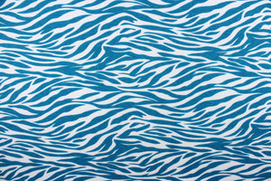  This jersey blend fabric features a zebra stripe design in teal and white.