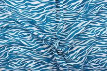 Load image into Gallery viewer,  This jersey blend fabric features a zebra stripe design in teal and white.
