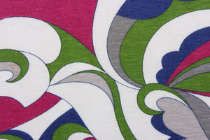  This jersey fabric features an abstract design in fuchsia, gray, green, blue and white.