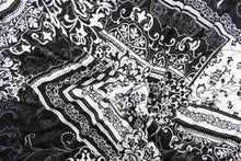 Load image into Gallery viewer, This fabric features a bandana design in black and white. Use this for apparel, etc. This fabric is fleece lined.
