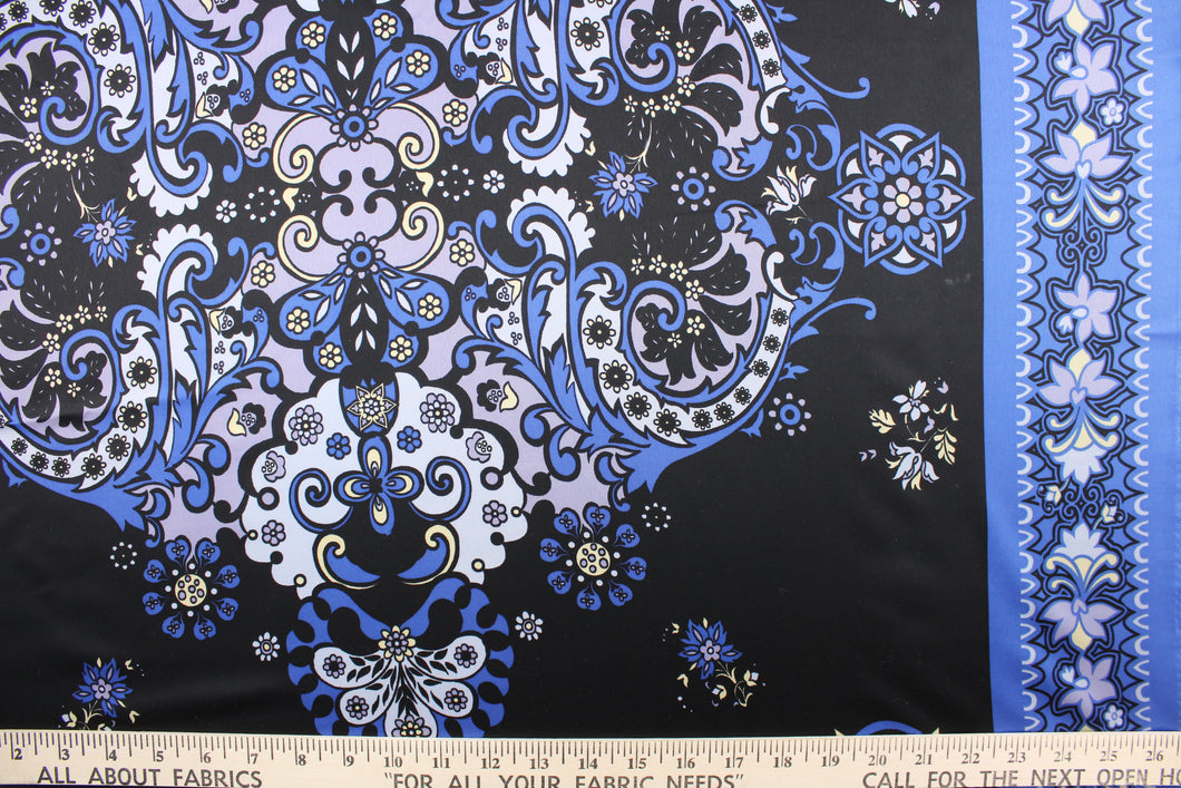This chiffon fabric features a floral design in blue, pale yellow, black, and silver.