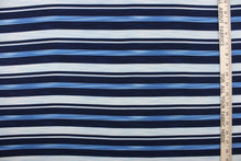 Load image into Gallery viewer,  This georgette fabric features a  stripe design in varying shades of blue and white. 
