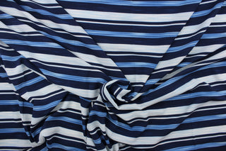  This georgette fabric features a  stripe design in varying shades of blue and white. 
