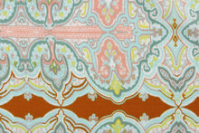 Load image into Gallery viewer, This chiffon fabric features a demask design in pale blue, seafoam green, pink, white, and yellow against a brown orange. 
