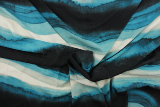 This chiffon fabric features a Ombre design in teal green, deep teal, turquoise, black, white, and gray. 