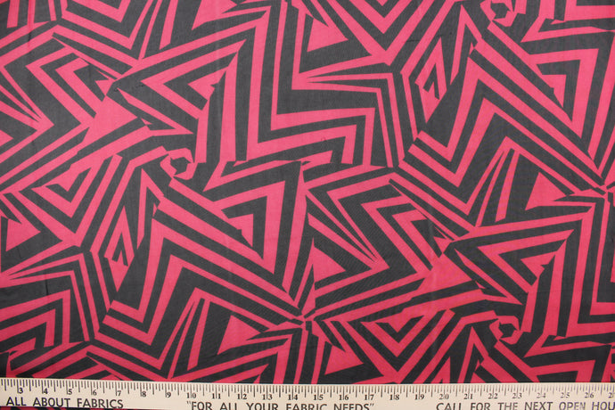 This chiffon fabric features a stripe design in black and red.