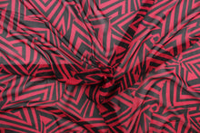 Load image into Gallery viewer, This chiffon fabric features a stripe design in black and red.
