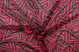 This chiffon fabric features a stripe design in black and red.