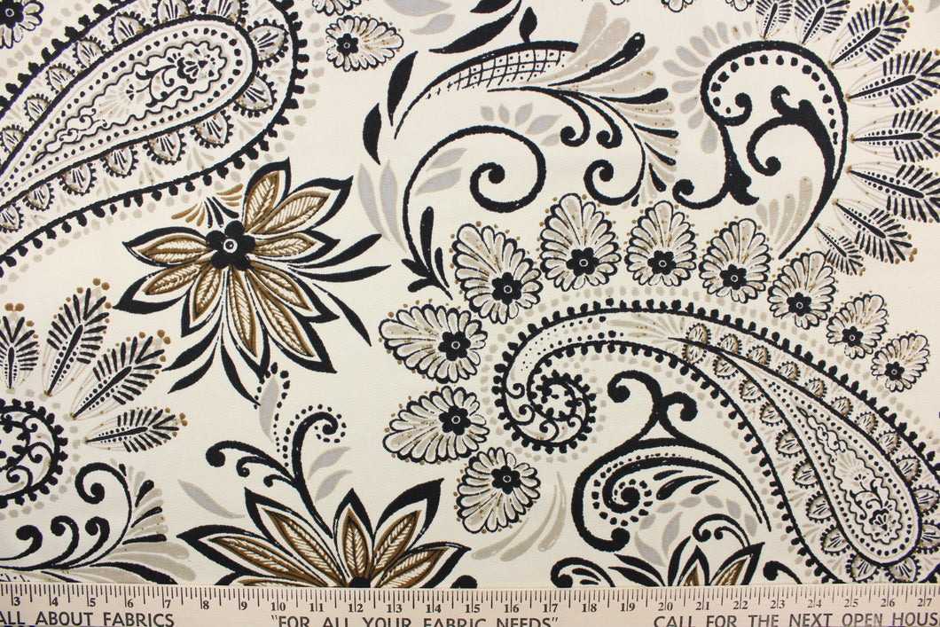 This fabric features a paisley floral design in black, brown, and gray against a off white background.