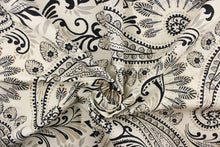 Load image into Gallery viewer, This fabric features a paisley floral design in black, brown, and gray against a off white background.
