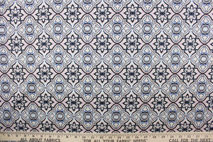 This fabric features a  geometric design in white, pink, black and blue.