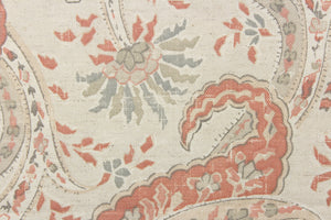This fabric features a paisley vine design in cream. gray, taupe, and coral pink with hints of light beige. 