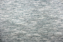 Load image into Gallery viewer,  This chenille fabric features a unique design in gray, silver, blue, teal, blue green, and white.

