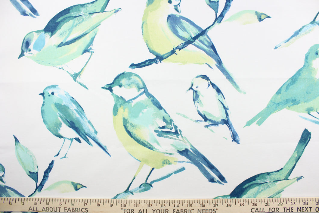 This fabric features a bird design in varying shades of turquoise, lime green, blue and white. 
