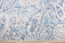 Load image into Gallery viewer, This fabric features a paisley design in varying shades of blue with some gray undertones against a off white.
