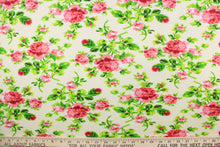 Load image into Gallery viewer, This jersey fabric features a floral design in pink, red, green, and off white. 
