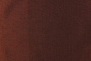 This taffeta fabric in a solid cognac brown.