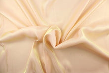 Load image into Gallery viewer, This taffeta fabric in iridescent in a pale orange. 
