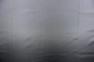 This taffeta fabric in solid in dark gray. 