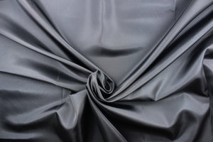 This taffeta fabric in solid in dark gray. 