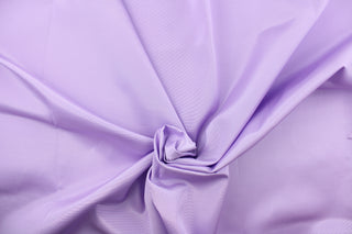 This bengaline faille fabric in a solid soft purple. This fabric has a slight shine and a slight ribs in the weft.